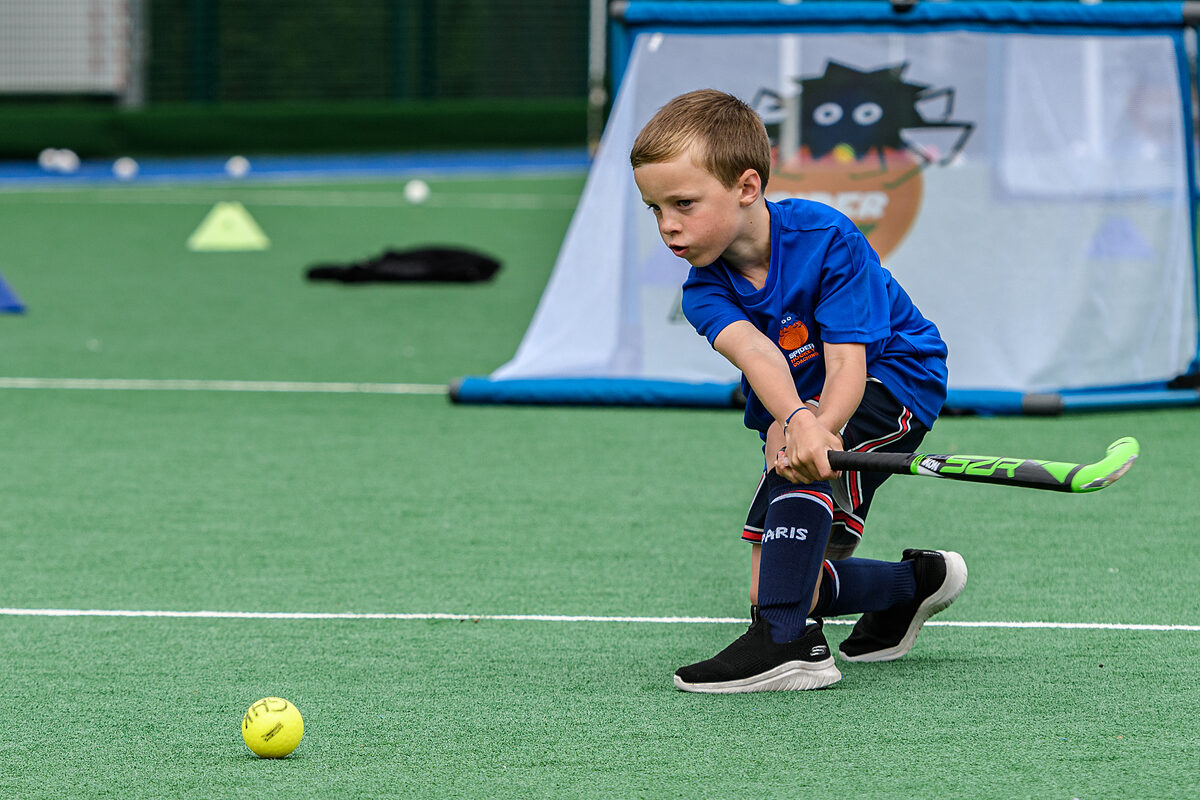 A junior player celebrating after scoring a goal